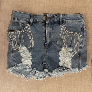 Distressed jean shorts with rhinestone detail